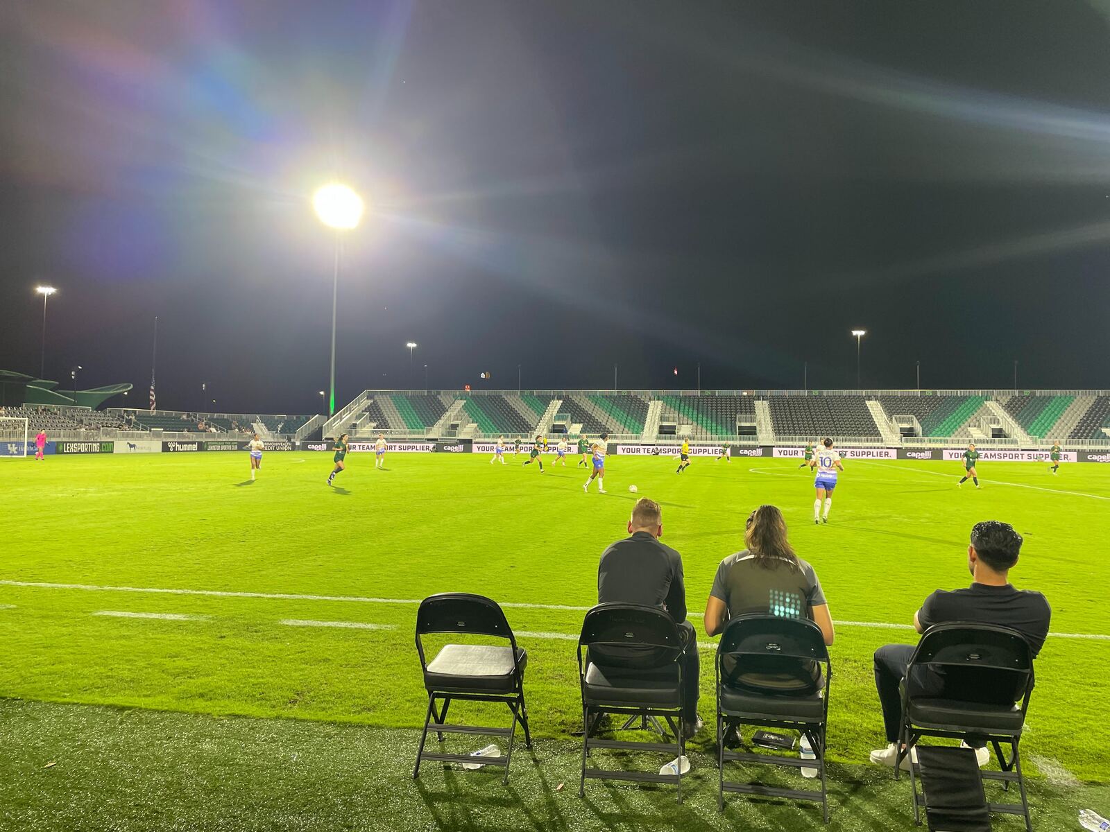 Women's professional soccer match under the lights
