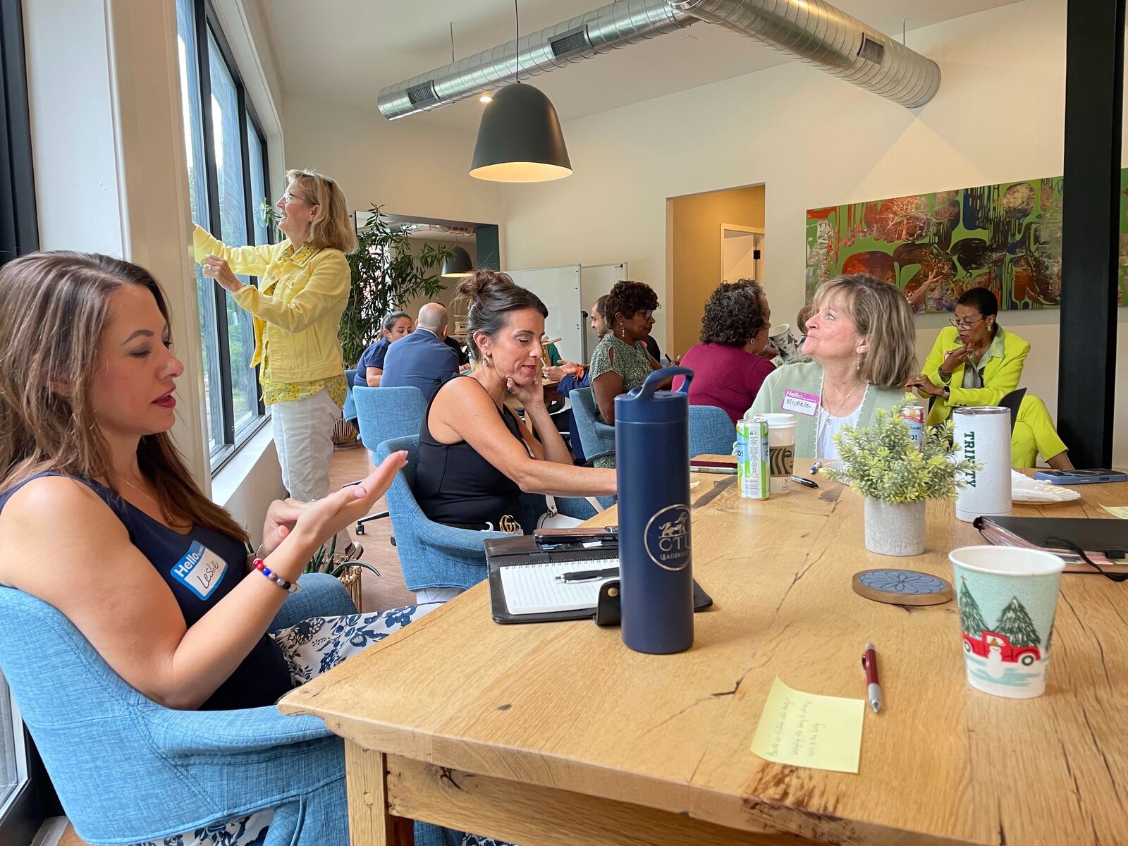 Workshop participants talking at a table